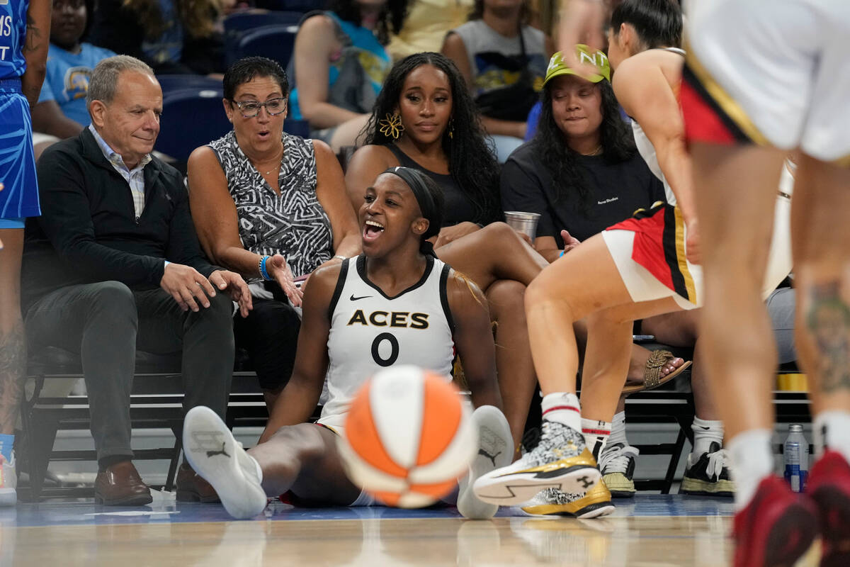 Las Vegas Aces guard Jackie Young falls out of bounds during the second half of the team's WNBA ...