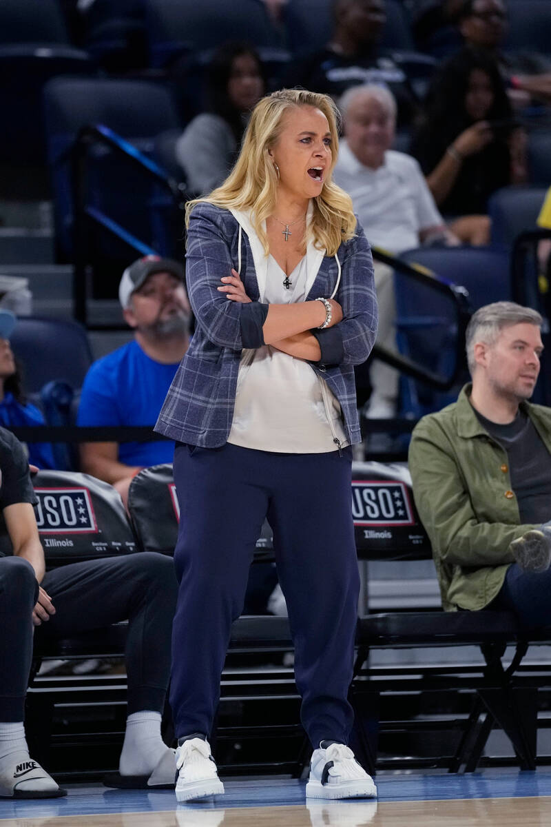 Las Vegas Aces coach Becky Hammon yells to players during the first half of the team's WNBA bas ...
