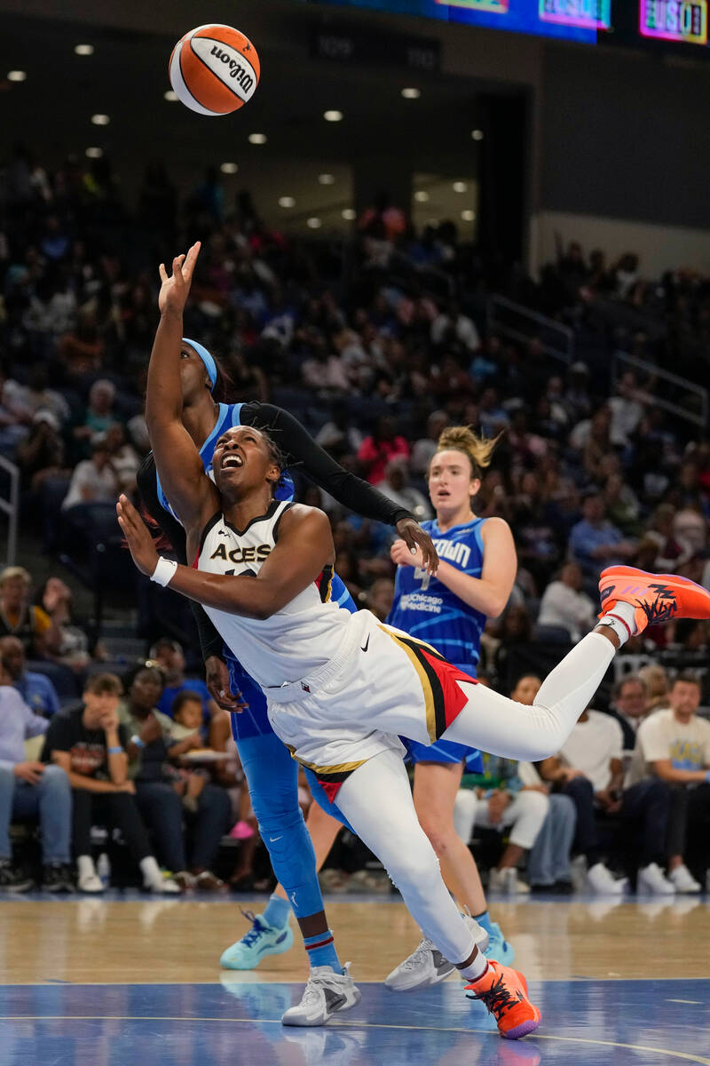 Las Vegas Aces guard Chelsea Gray shoots, and is fouled by Chicago Sky guard Kahleah Copper, le ...