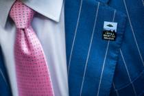 An audience member wears a UFO pin during a House Oversight and Accountability subcommittee hea ...