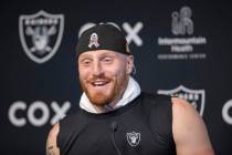 Raiders defensive end Maxx Crosby reacts with laughter during a news conference at Intermountai ...