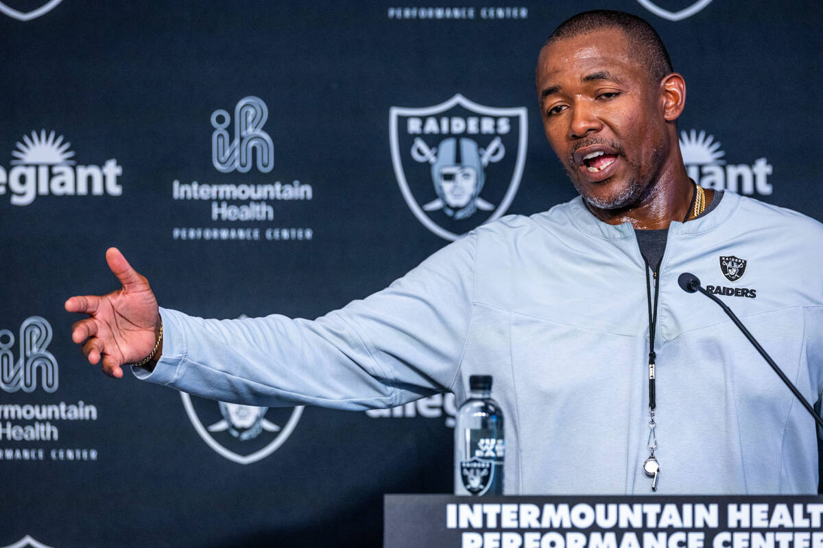 Raiders defensive coordinator Patrick Graham talks to the media during training camp at the Int ...