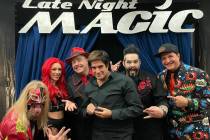 David Copperfield, holding his silver F-bomb counter, poses with the cast of "Late Night Magic" ...