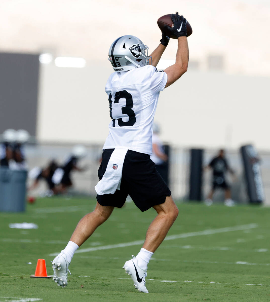 Raiders wide receiver Hunter Renfrow (13) catches a pass during training camp at the Intermount ...