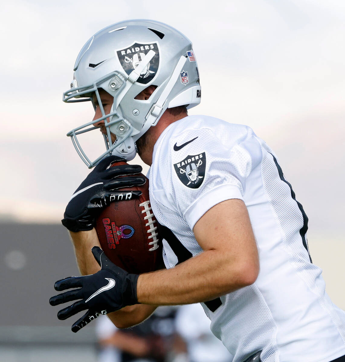 Raiders wide receiver Hunter Renfrow (13) runs with the ball during training camp at the Interm ...