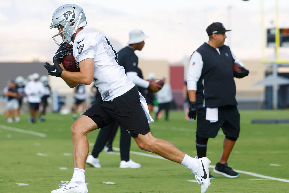 Raiders wide receiver Hunter Renfrow (13) runs with the ball during training camp at the Interm ...