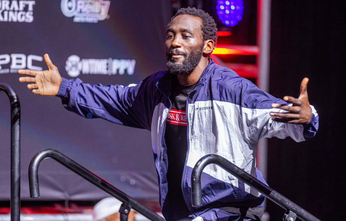 Boxer Terence Crawford arrives on stage for his weigh in ahead of the fight against Errol Spen ...