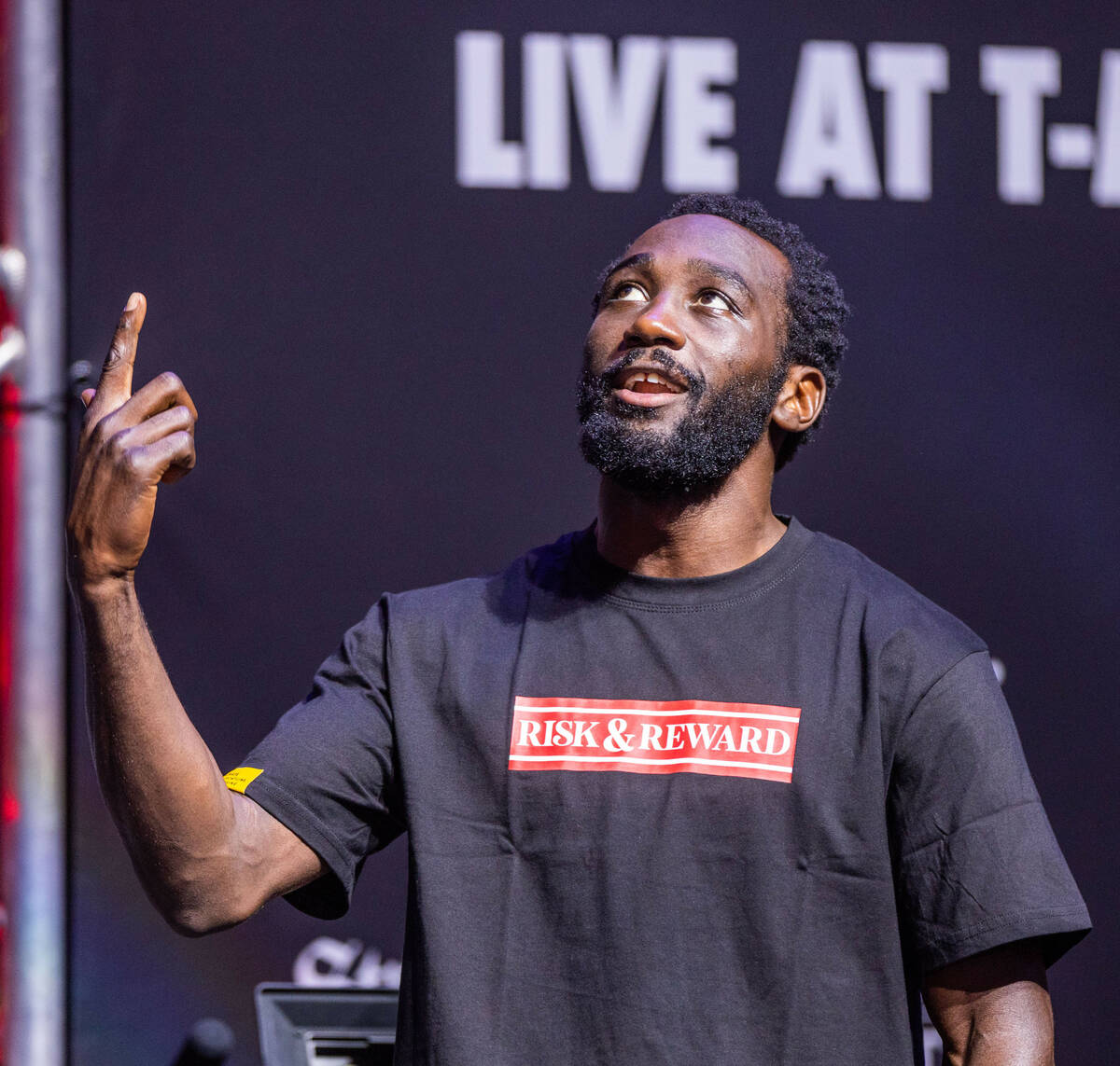 Boxer Terence Crawford sings to a rap song on stage before his weigh-in ahead of the fight agai ...