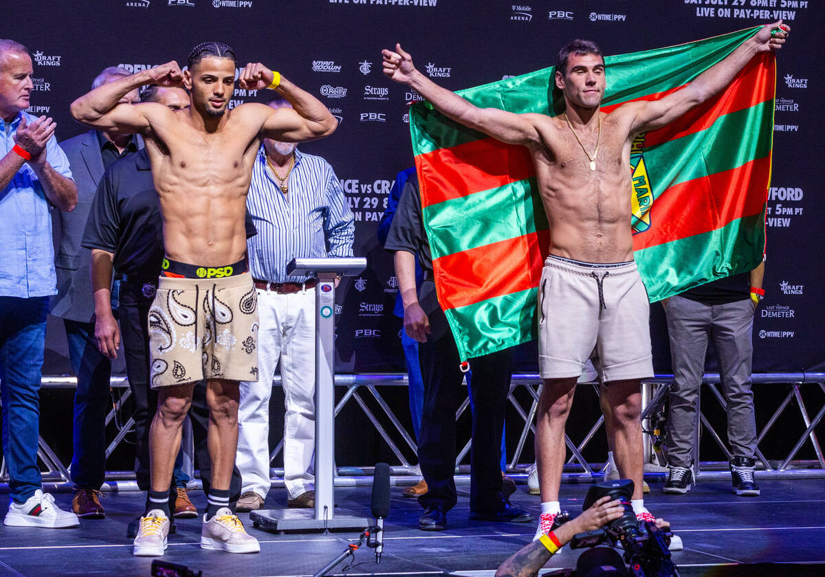 Boxers Yoenis Tellez and Sergio Garcia pose following their weigh-ins ahead of their fight at T ...