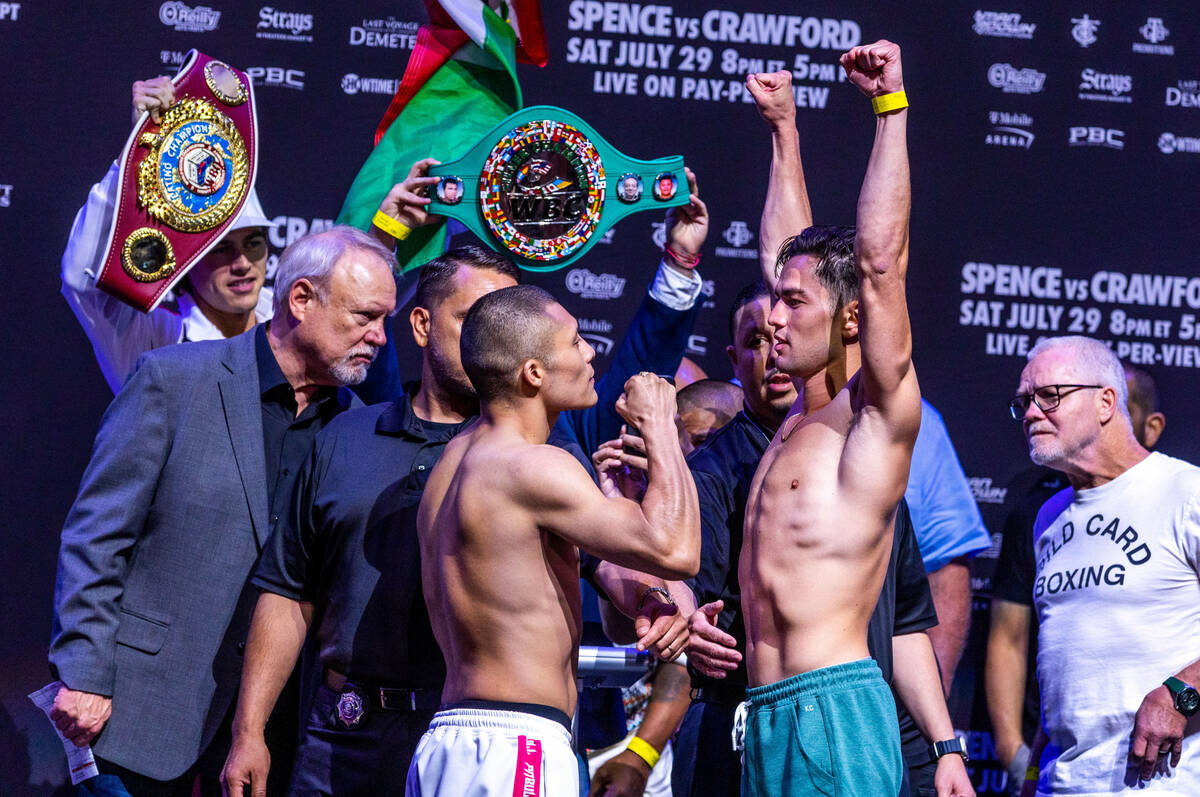 Boxers Isaac Cruz faces off with Giovanni Cabrera following their weigh ins ahead of their figh ...