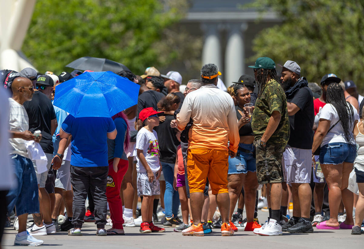 Fans wait outside in the heat for the opportunity to watch boxers Errol Spence Jr. and Terence ...