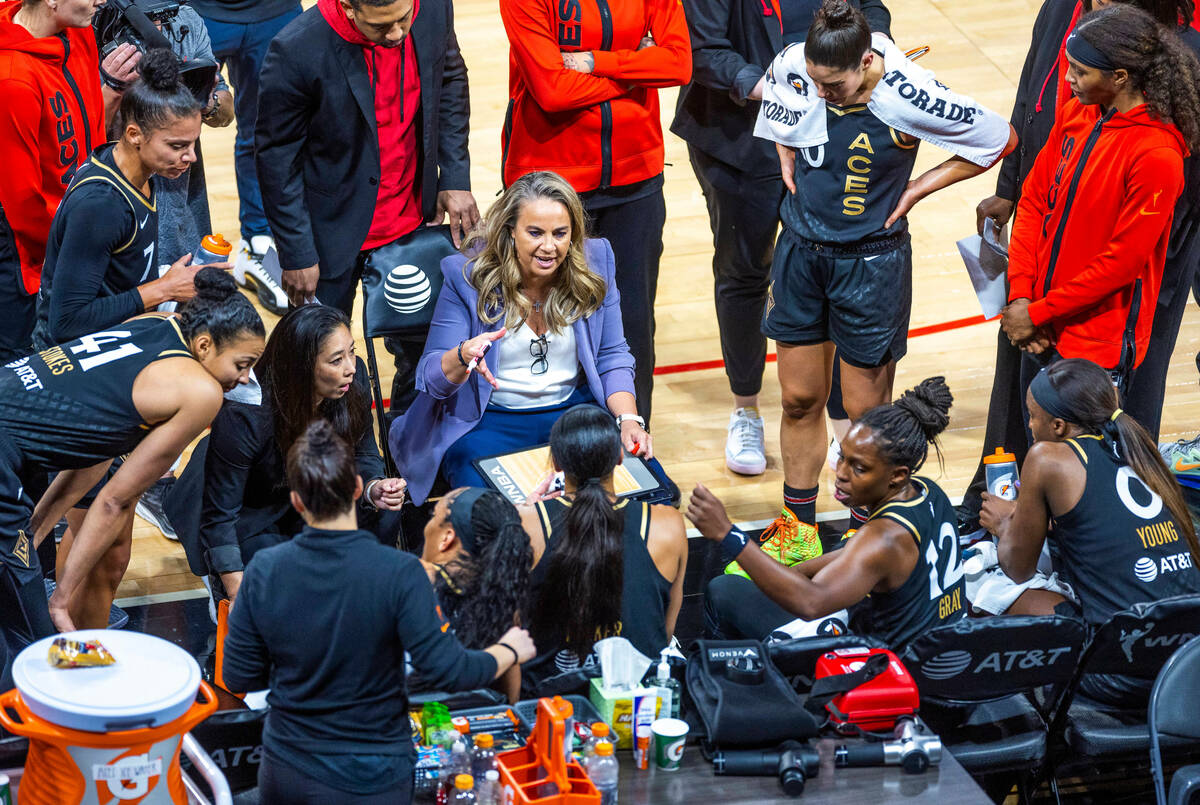 Las Vegas Aces head coach Becky Hammon counsels players during a timeout against the Connectic ...