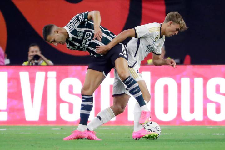 Manchester United defender Diogo Dalot, left, and Real Madrid midfielder Nicolas "Nico&quo ...