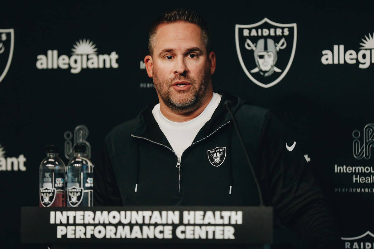 Raiders head football coach Josh McDaniels speaks to the media during training camp at the Inte ...