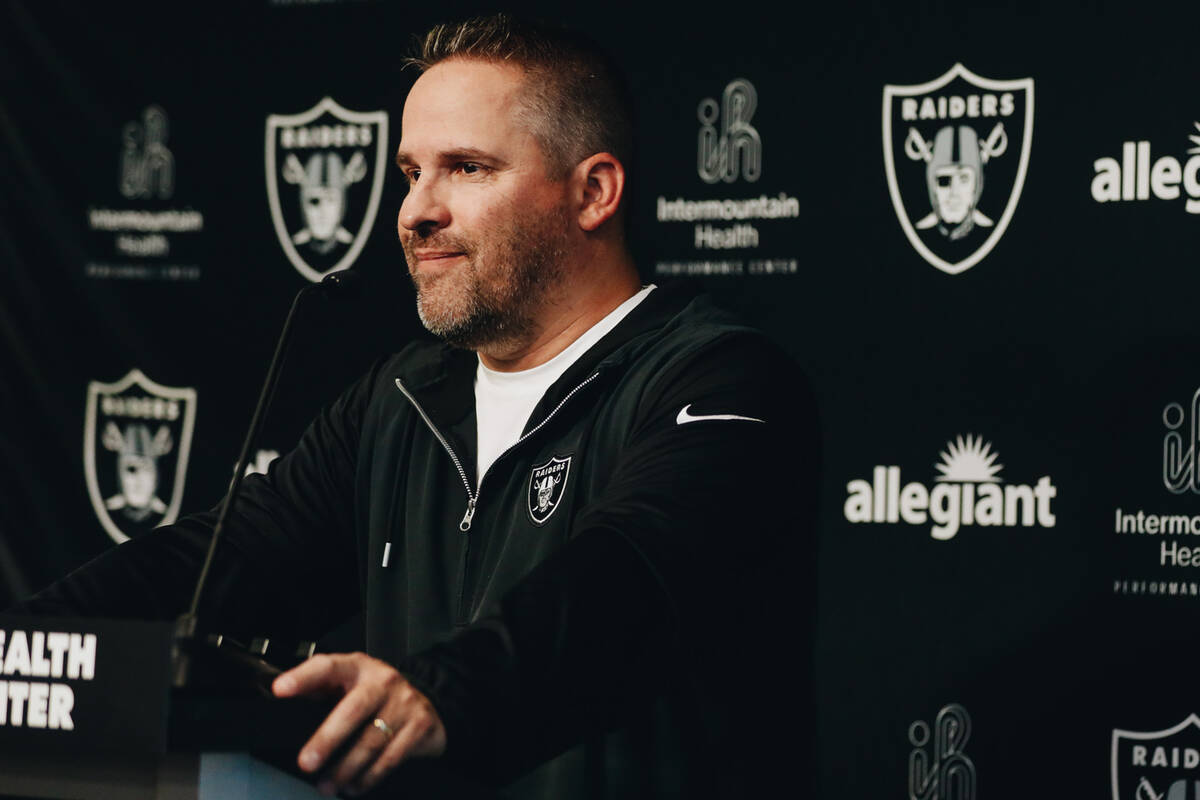 Raiders head football coach Josh McDaniels speaks to the media during training camp at the Inte ...