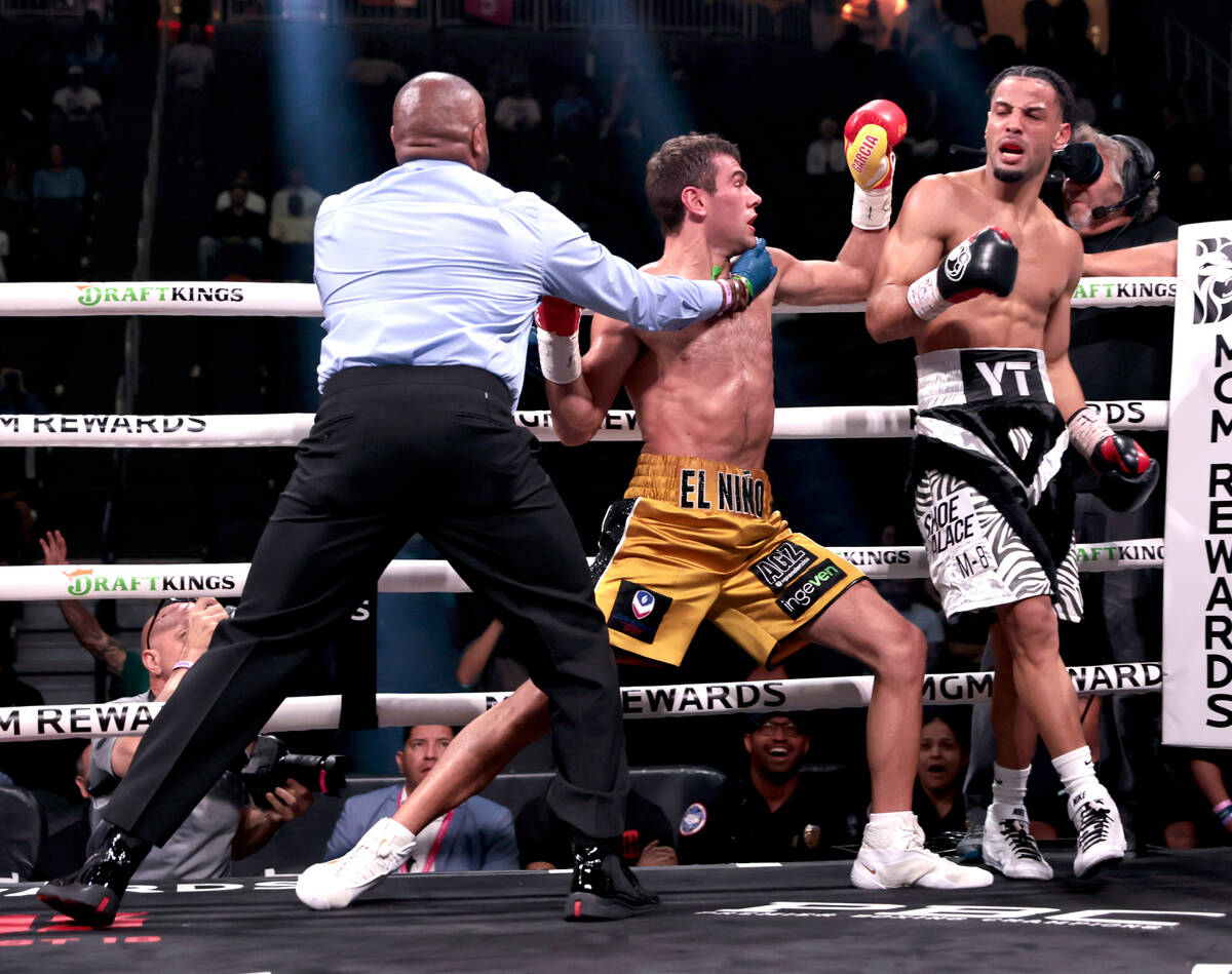 Boxer Sergio Garcia goes after Yoenis Tellez after the fight is stopped in round 3 in a super w ...