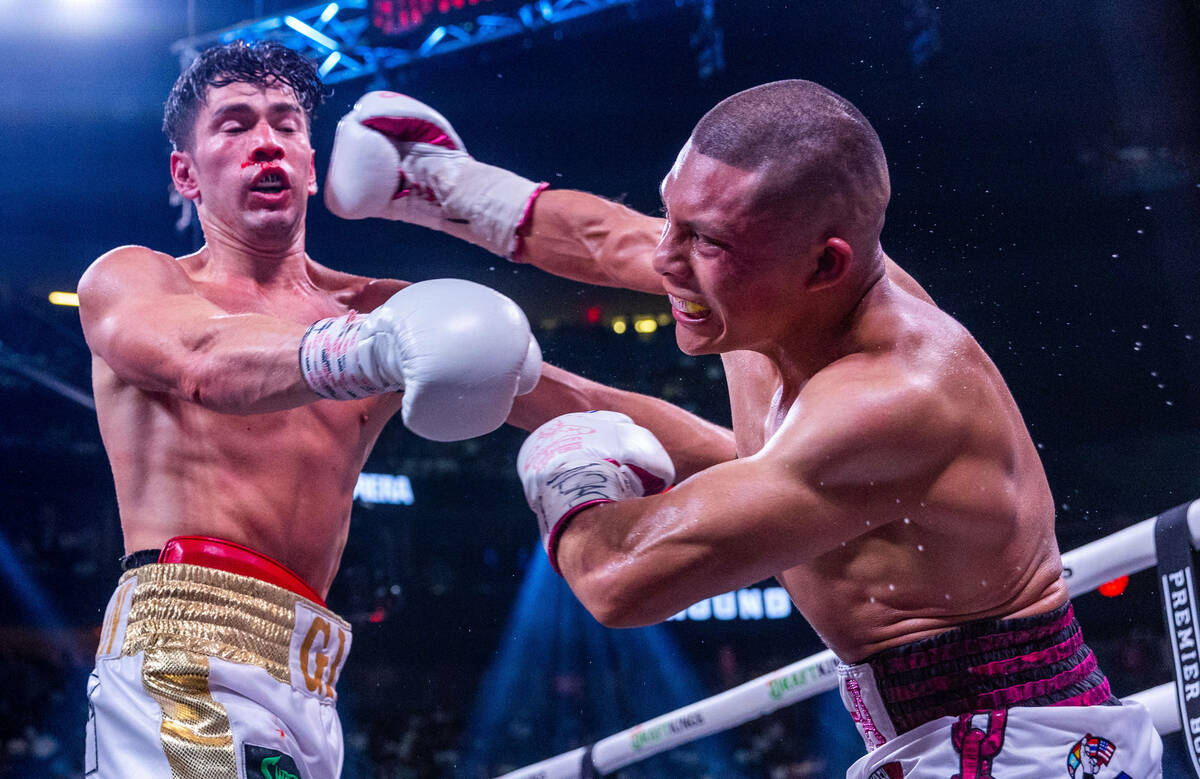 Giovanni Cabrera trades punches with Isaac Cruz in round 12 during world welterweight, WBC Silv ...