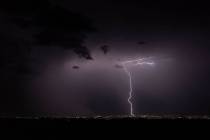 Lightning strikes across the skyline on Thursday, July 28, 2022, in Las Vegas. (L.E. Baskow/Las ...