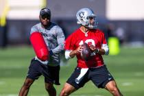 Raiders quarterbacks Jimmy Garoppolo (10) sets up to pass during training camp at the Intermoun ...