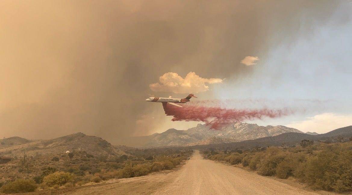 An air tanker drops fire retardant on the north end of the York fire on Saturday, July 29, 2023 ...