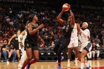 Las Vegas Aces guard Chelsea Gray (12) prepares to take a shot during a WNBA basketball game ag ...