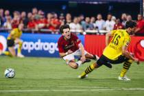 Manchester United winger Facundo Pellistri Rebollo (28) reacts as he trips over Borussia Dortmu ...