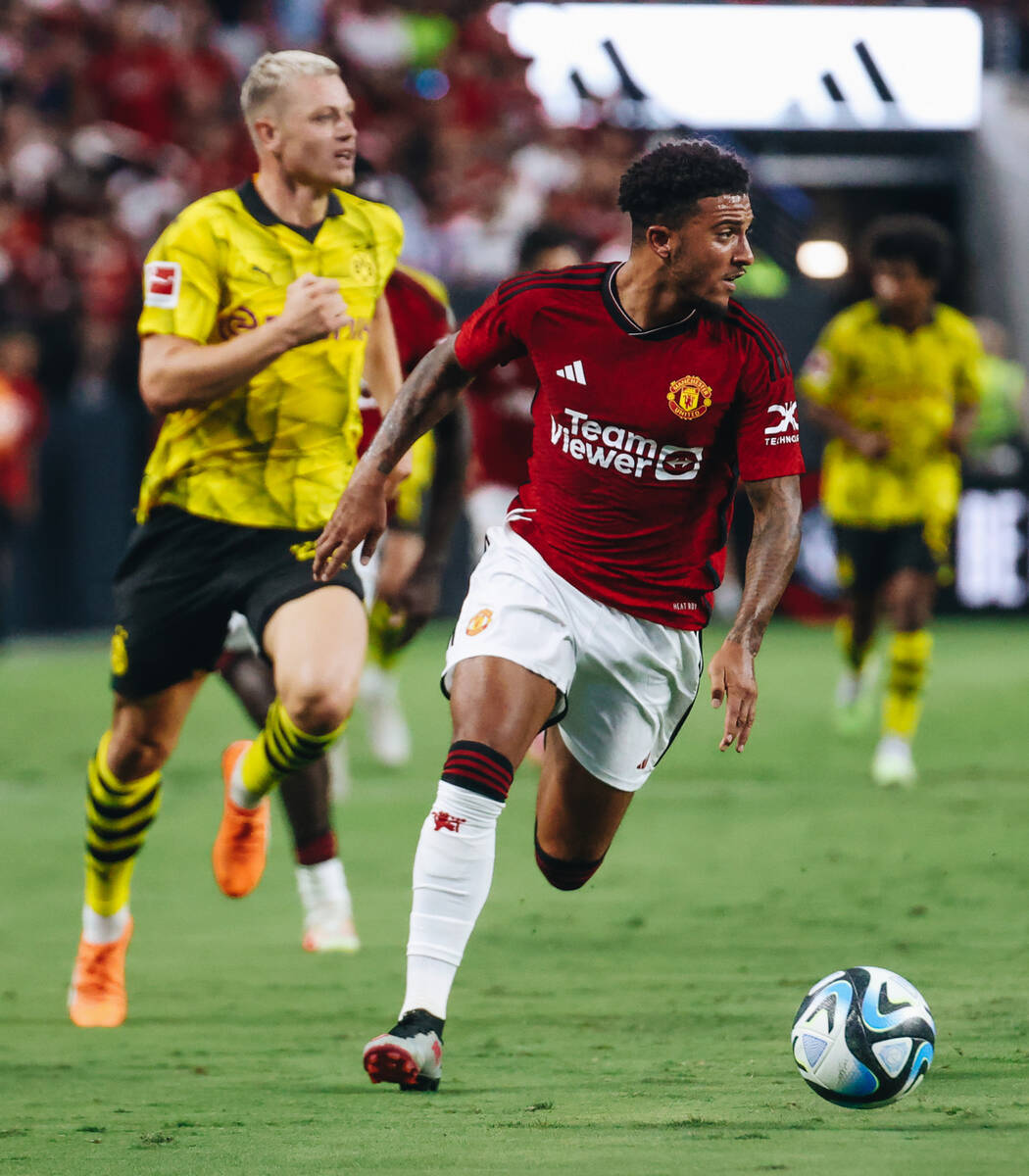 Manchester United forward Jadon Sancho (25) kicks the ball towards the net during a game agains ...