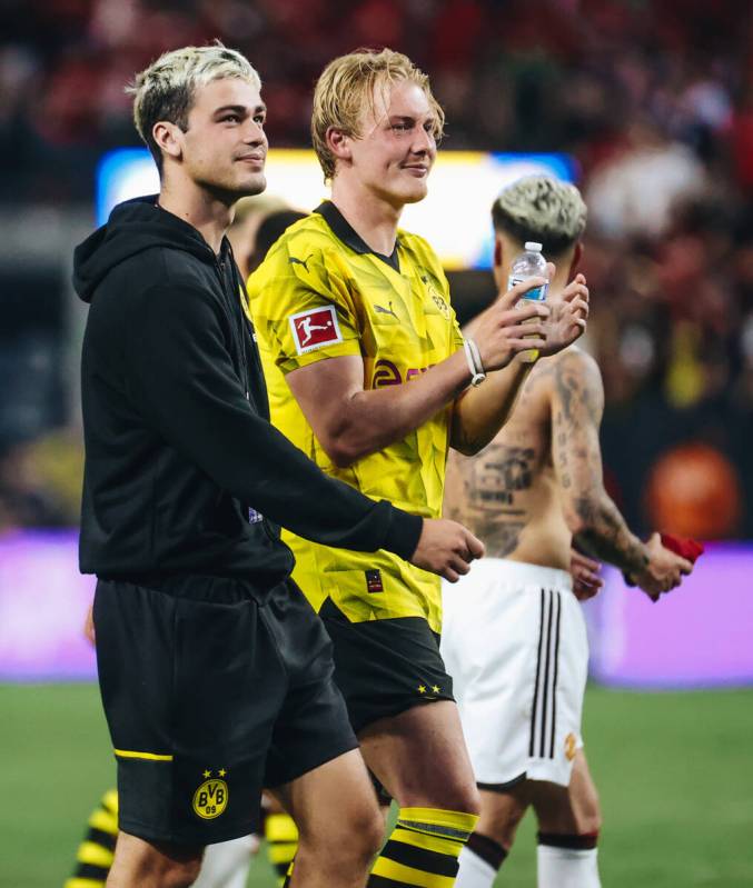 Team USA soccer star and Borussia Dortmund winger Gio Reyna, front, walks onto the field after ...