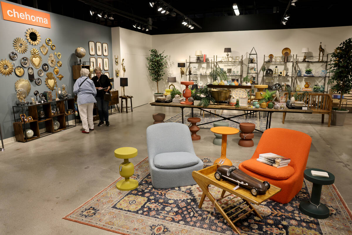 Conventioneers mingle at the Stephen Young showroom during the biannual Las Vegas Market home f ...