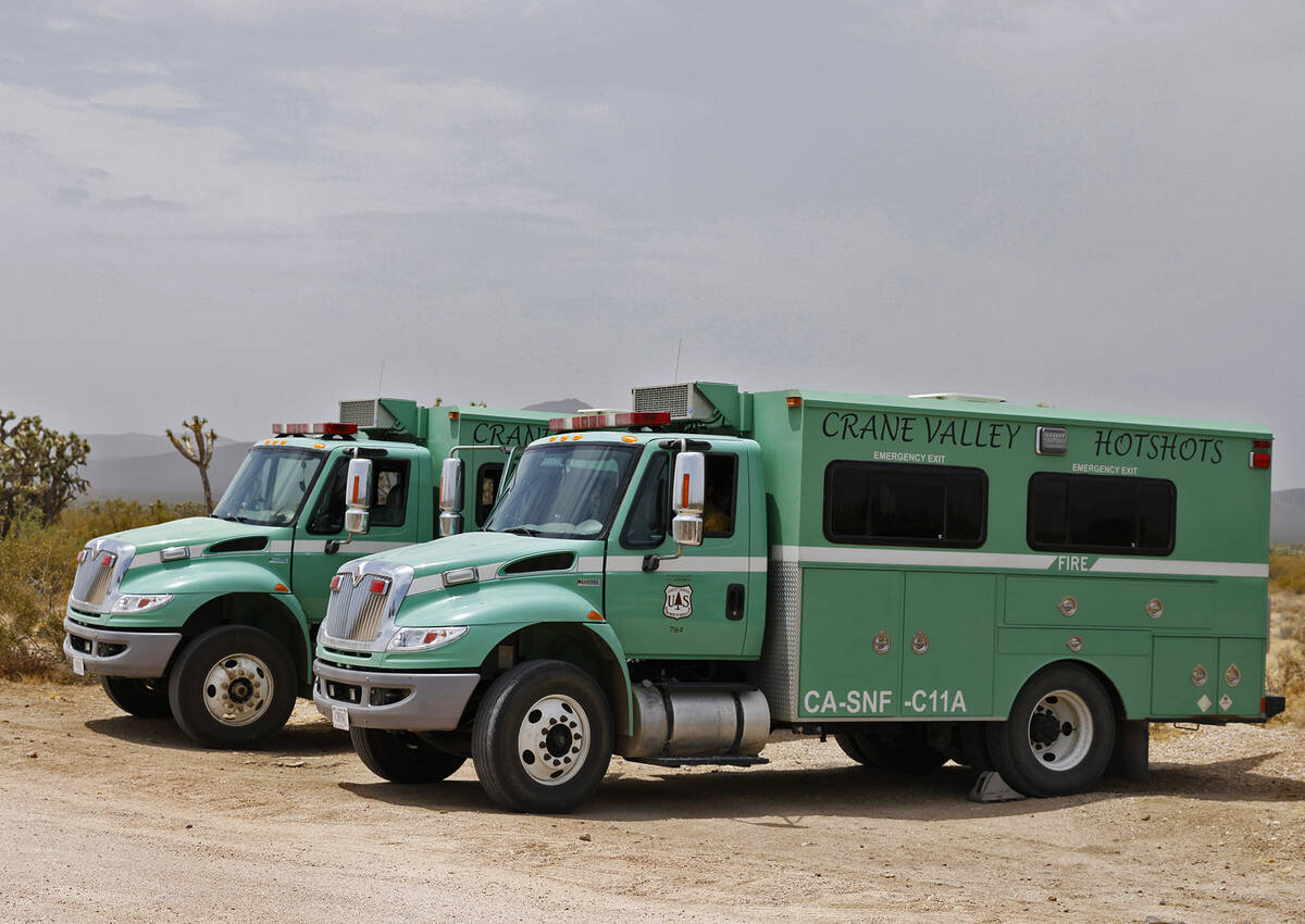The Crane Valley Hotshots trucks are stationed between Nipton and Searchlight, on Monday, July ...
