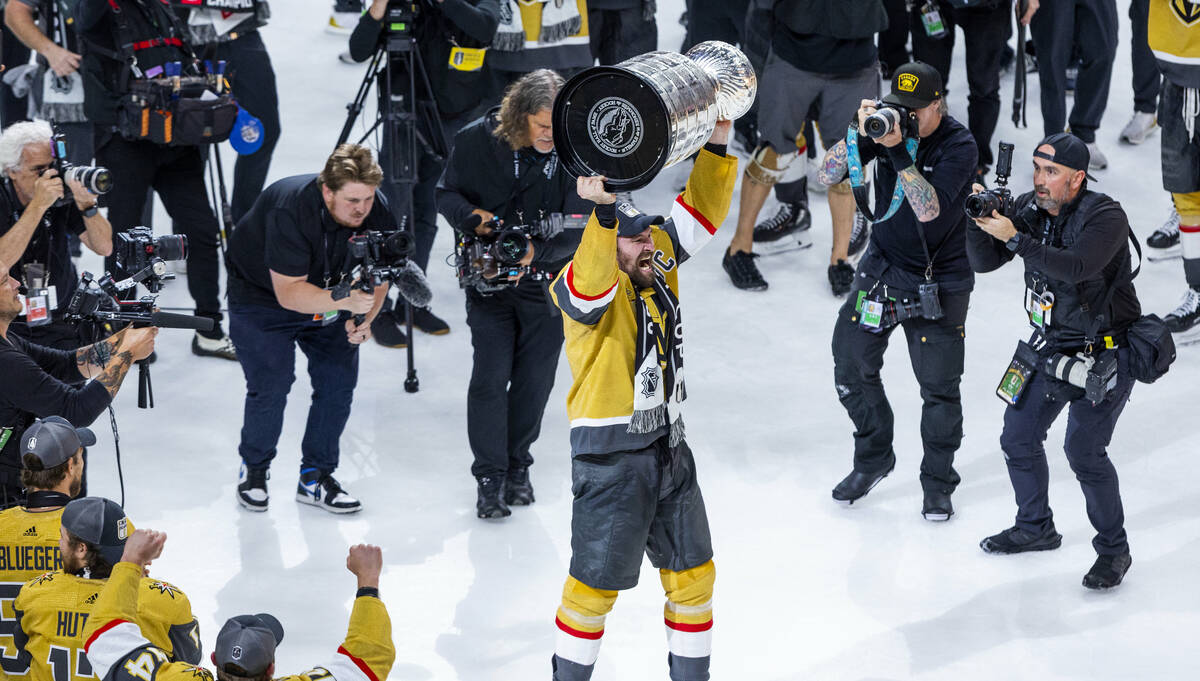 Golden Knights right wing Mark Stone (61) hoists the Stanley Cup with the Golden Knights defeat ...