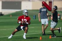Raiders quarterback Jimmy Garoppolo runs through a drill during training camp at the Intermount ...