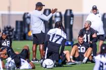 Raiders defensive coordinator Patrick Graham talks with LB Robert Spillane (41) during training ...