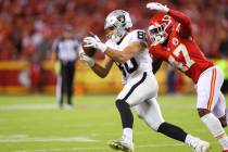 Raiders tight end Jesper Horsted (80) makes a catch under pressure from Kansas City Chiefs line ...