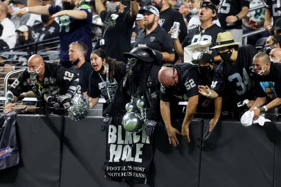 Fans in the Black Hole cheer during the third quarter of the Raiders home opening pre-season NF ...