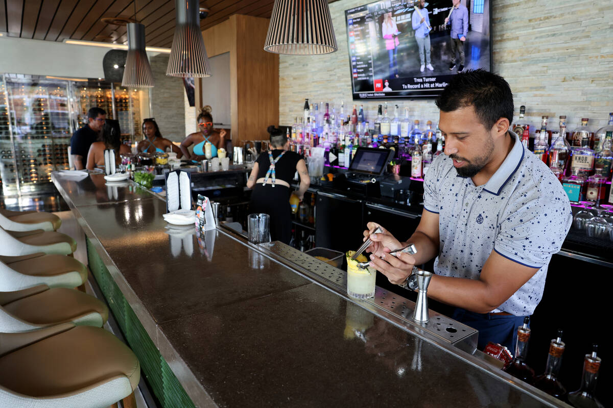 Manager Nick Vasquez makes an On Island Time signature cocktail at Laguna Pool House & Kitc ...