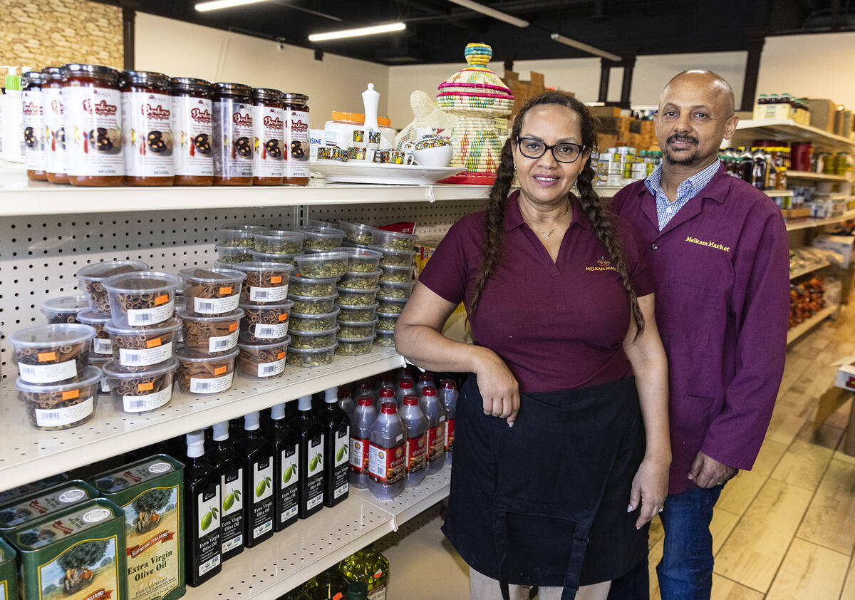 Melkam Ethiopian Market co-owners Eleni Belete and her husband Mehari Merhe pose for a photo a ...