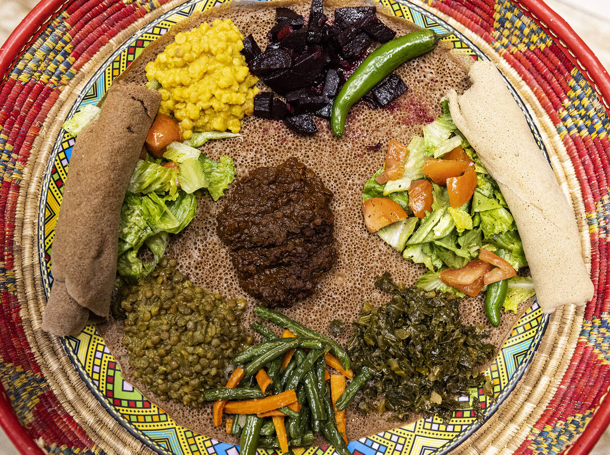 Yetsom Beyaynetu, also known as veggie combinations, is displayed at Melkam Ethiopian Market at ...