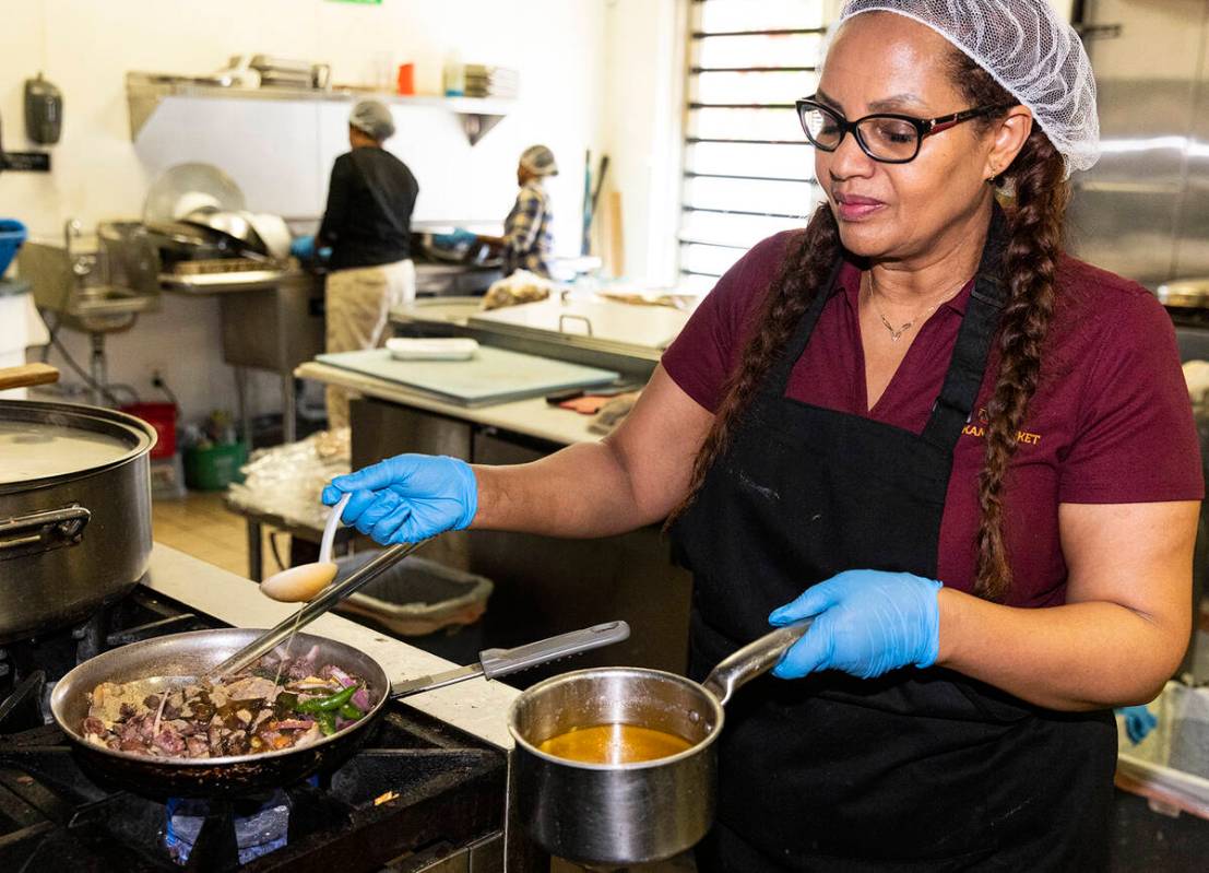 Eleni Belete, Melkam Ethiopian Market co-owner and head chef, prepares Lega Tibs at her store a ...