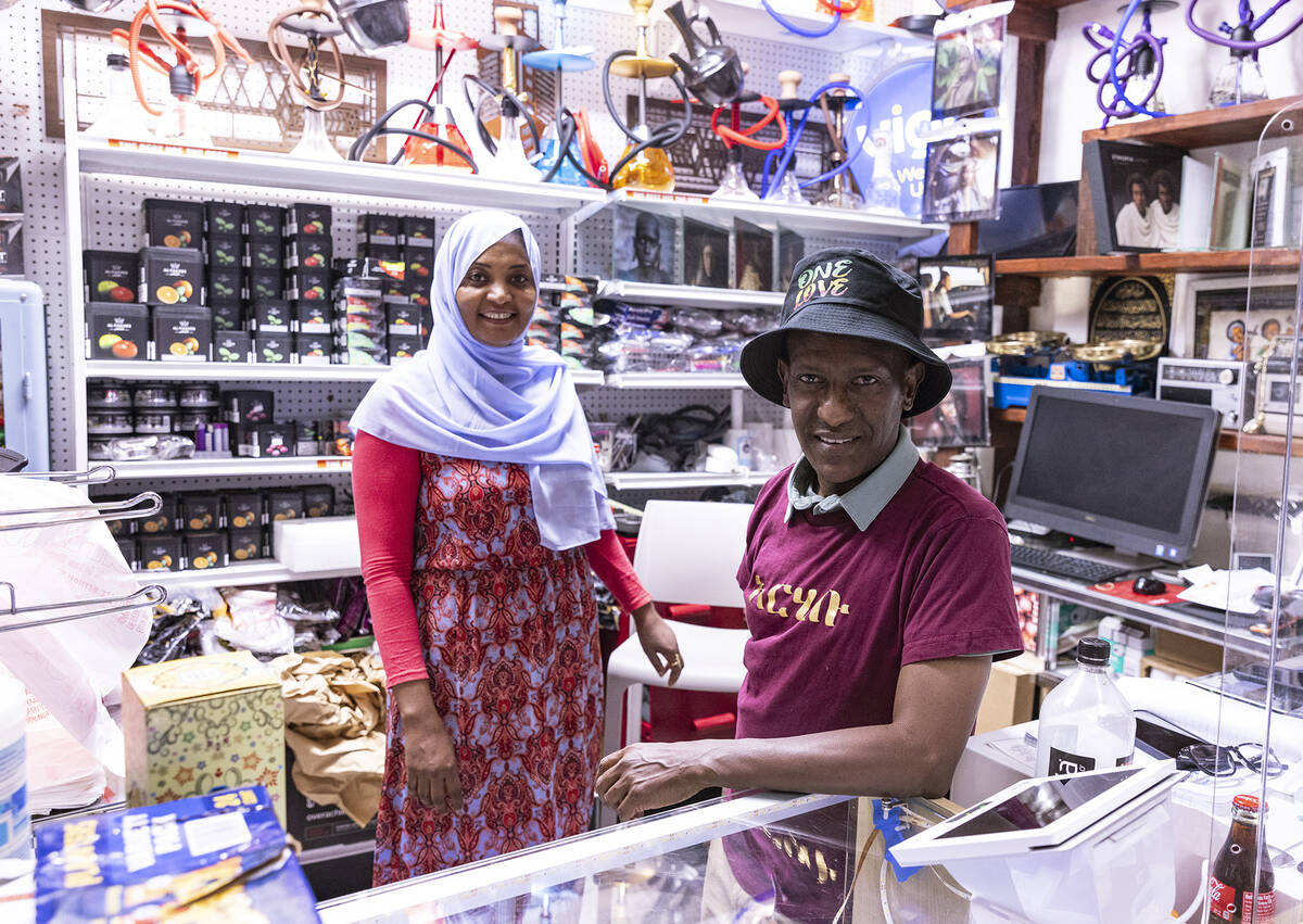 Unity Ethiopian Market owners Sirage Awoll and his wife Fatuma Mengesh pose for a photo a their ...