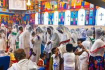 Worshippers line up to receive communion at Hamere Noah Kidane Mehret and St Michael Ethiopian ...