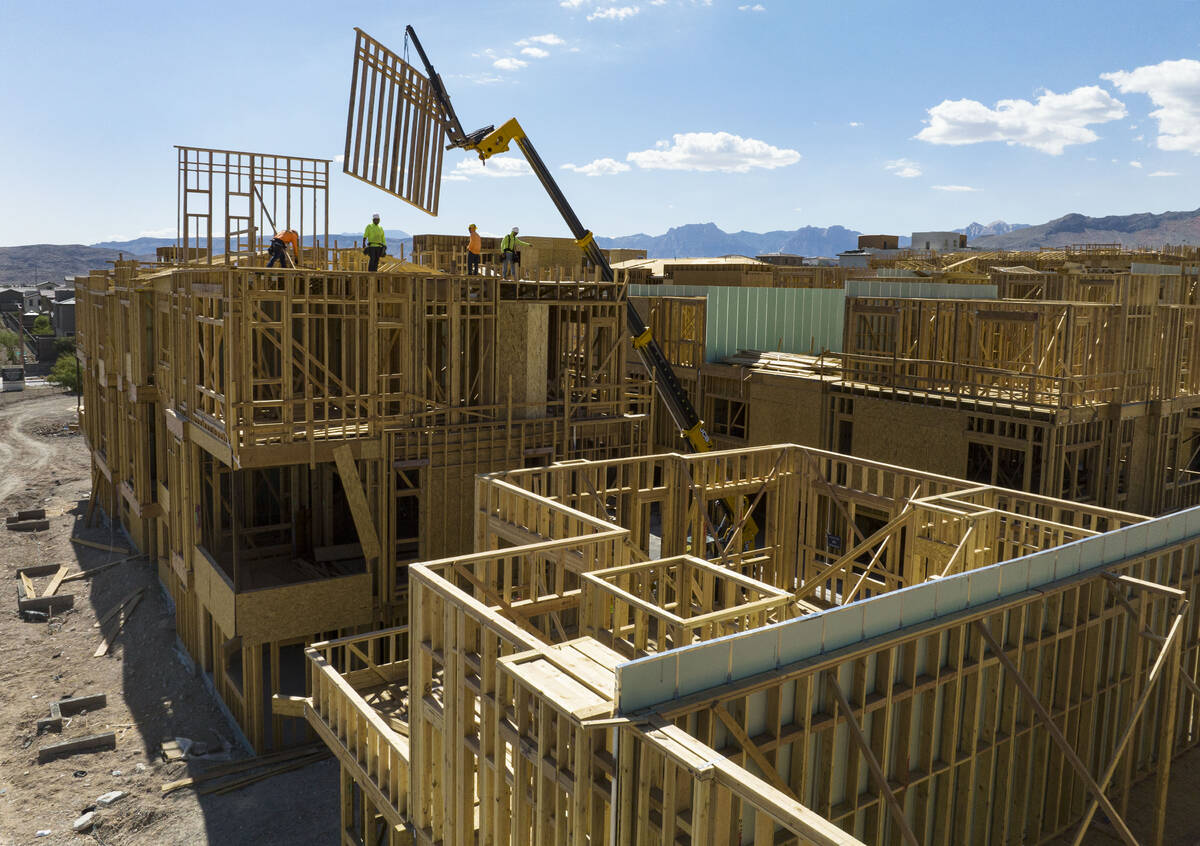 File Last year construction workers help build a new Summerlin neighborhood. Las Vegas-based Ho ...
