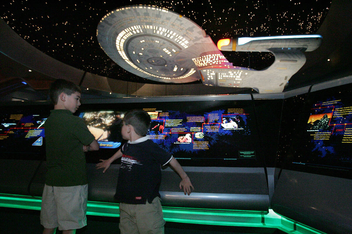 Austin Hajek, 8, left and Cole Hajek, 5, check out the "space travel timeline" at "Star Trek: T ...