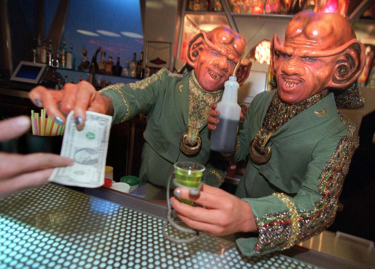 Ferengis serve up drinks at Quark's Bar & Restaurant inside "Star Trek: The Experience" at the ...