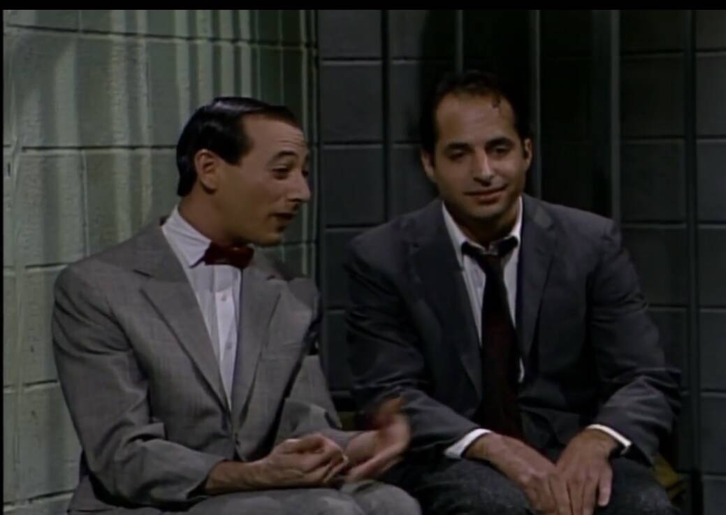 A screen grab of Paul Reubens as Pee-wee Herman and Jon Lovitz as Tommy Flanagan "Saturday Nigh ...