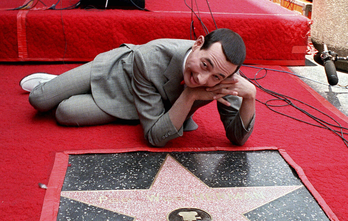 Pee Wee Herman, whose real name is Paul Reubens, admires his star on the Walk of Fame in Hollyw ...