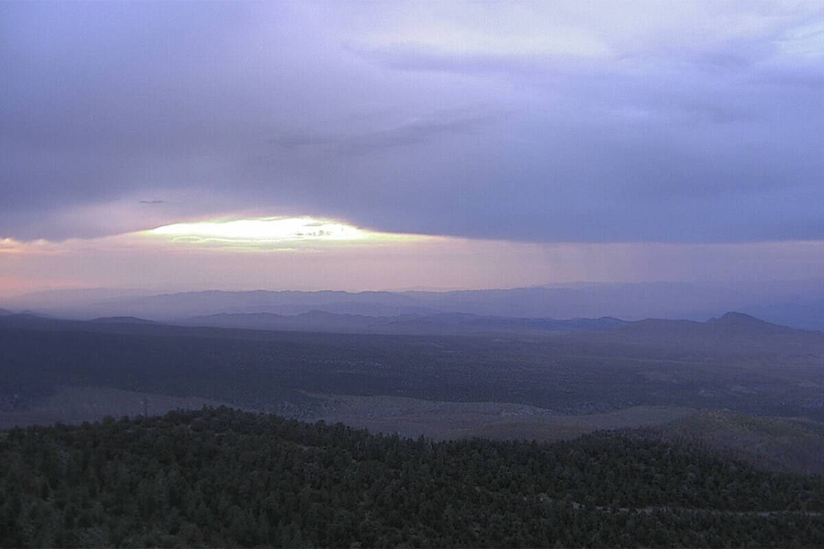 Heavy storm clouds linger over Angel Peak near Mt. Charleston around 7:45 p.m. on Tuesday, Aug. ...