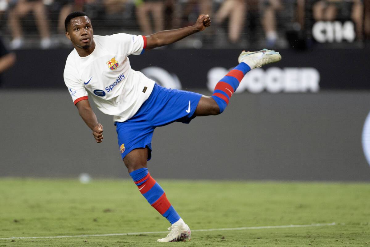 Barcelona forward Ansu Fati (10) watches his goal score on Milan during the second half of a So ...