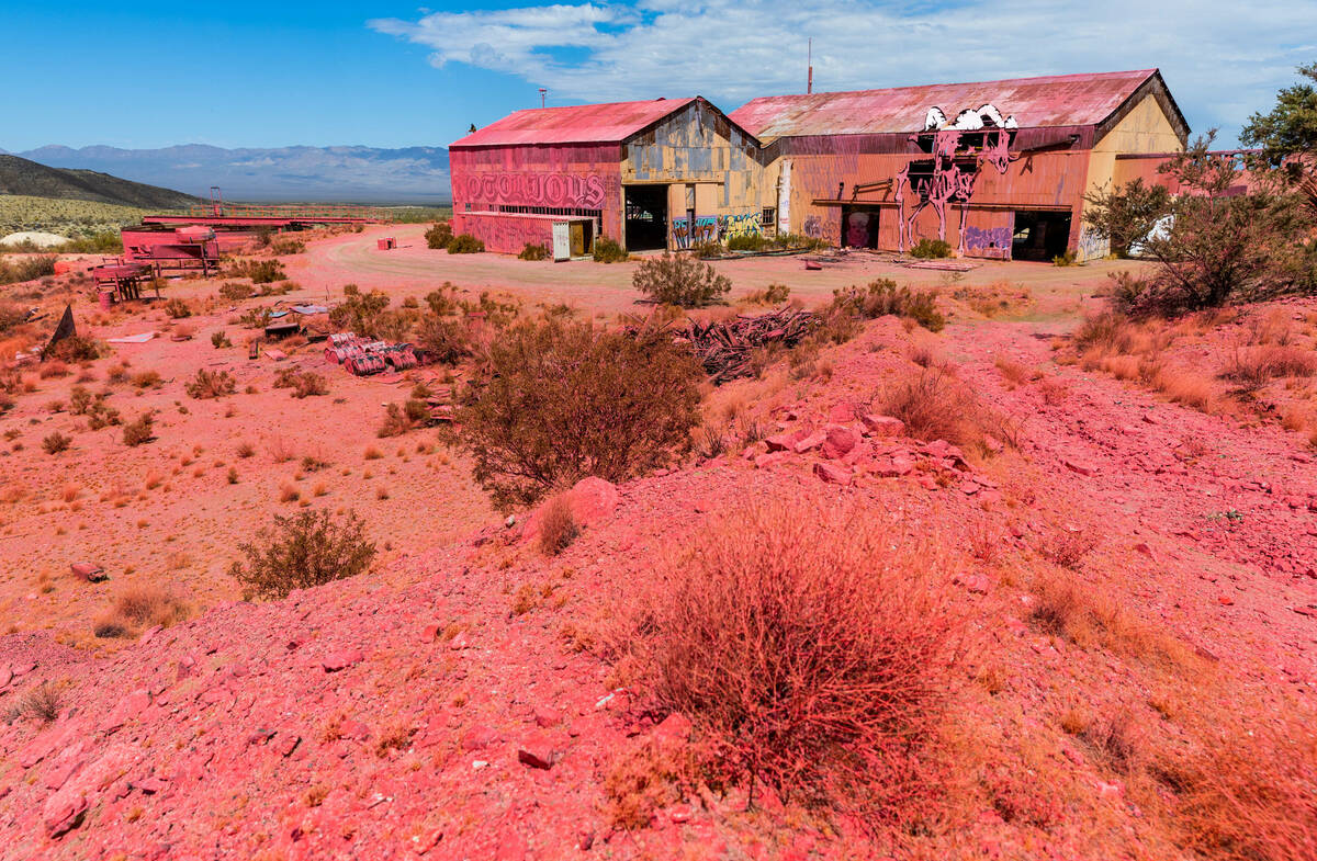 Pink fire retardant covers the former Goldome Mill as the York Fire along Ivanpah Road is bette ...