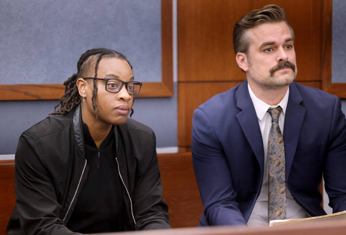 Las Vegas Aces WNBA basketball player Riquna Williams, left, talks with her attorney Brandon Al ...